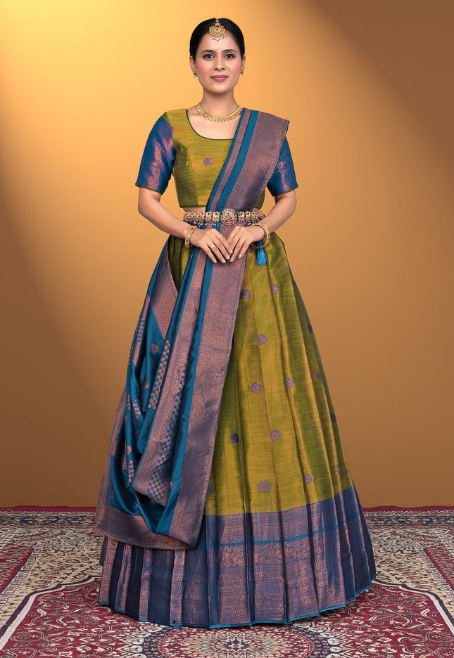 Woman wearing a green and blue lehenga choli