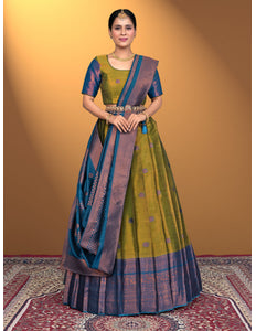 Woman wearing a green and blue lehenga choli