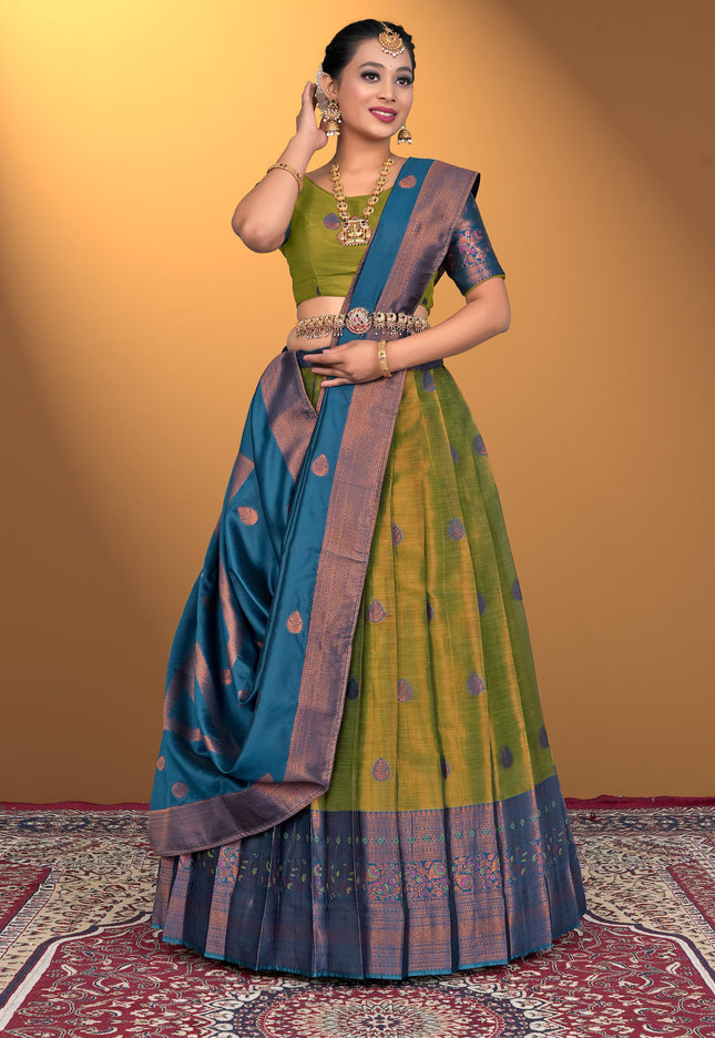 Woman wearing a traditional green and blue lehenga choli
