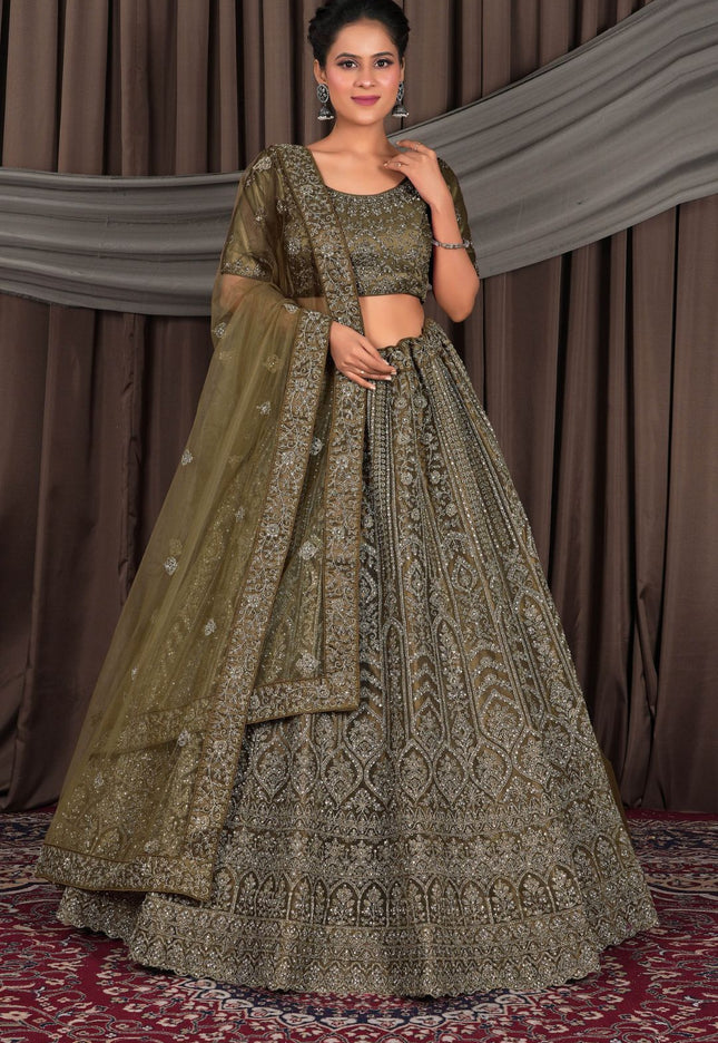 Woman wearing a traditional mehendi embroidered outfit