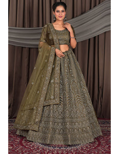 Woman wearing a traditional mehendi embroidered outfit