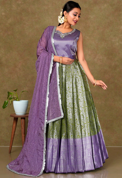 Woman wearing a traditional outfit with a purple and green dress