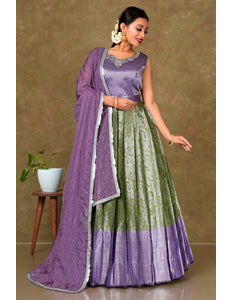 Woman wearing a traditional outfit with a purple and green dress