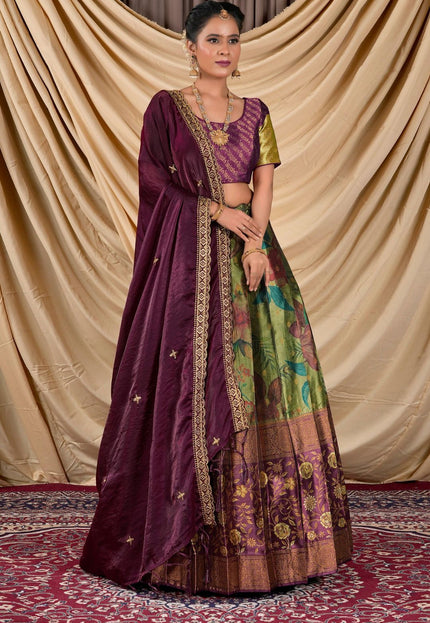 Woman wearing a traditional outfit with a purple dupatta and colorful skirt