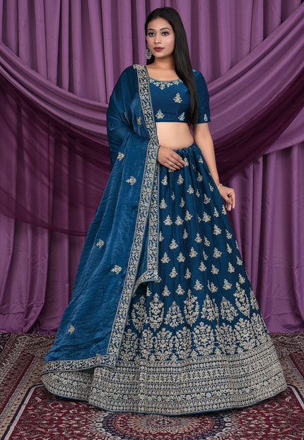 Woman wearing a blue embroidered traditional outfit