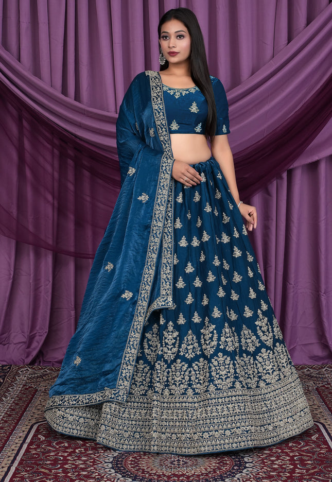 Woman wearing a blue embroidered traditional outfit