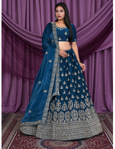 Woman wearing a blue embroidered traditional outfit