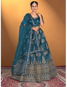 Woman wearing a traditional blue embroidered outfit