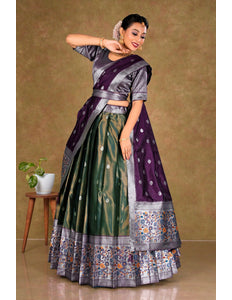 Woman in a traditional purple and green lehenga choli with dupatta