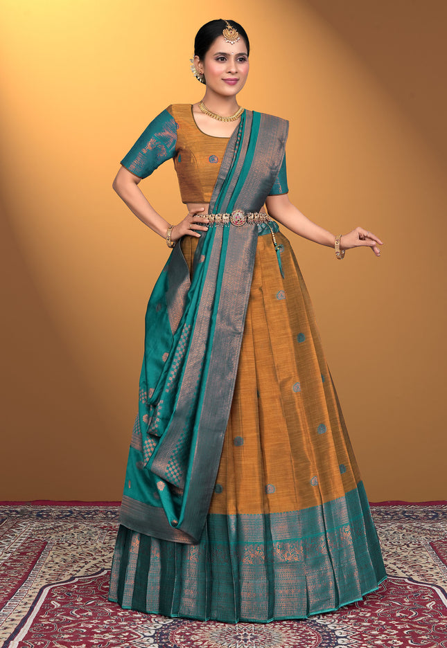 Woman wearing a traditional lehenga choli with a Musterd and green color
