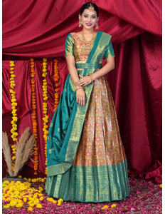 Woman in traditional green and gold lehenga choli