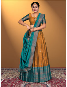 Woman wearing a traditional lehenga choli with a yellow and blue color