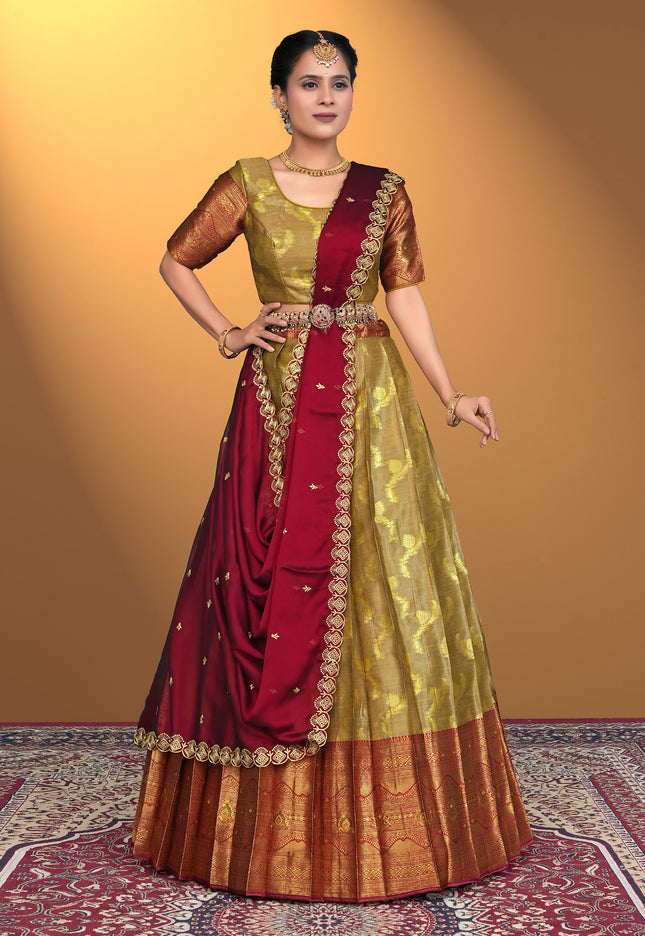 Woman wearing a traditional red and musterd lehenga choli