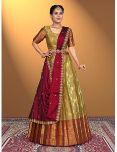 Woman wearing a traditional red and musterd lehenga choli
