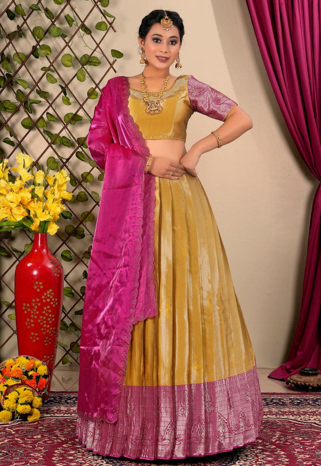 Woman in a yellow and pink traditional lehenga choli with dupatta