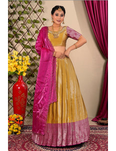 Woman in a yellow and pink traditional lehenga choli with dupatta