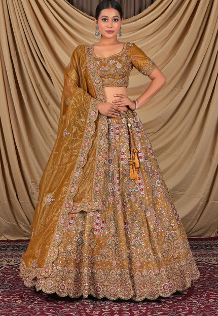 Traditional yellow embroidered outfit with a matching dupatta