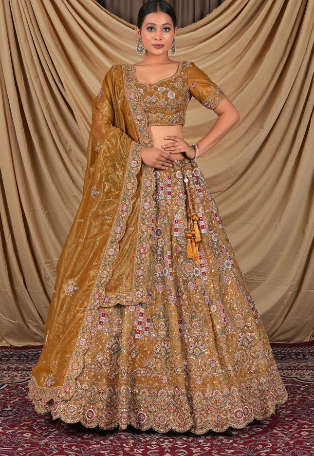Traditional yellow embroidered outfit with a matching dupatta