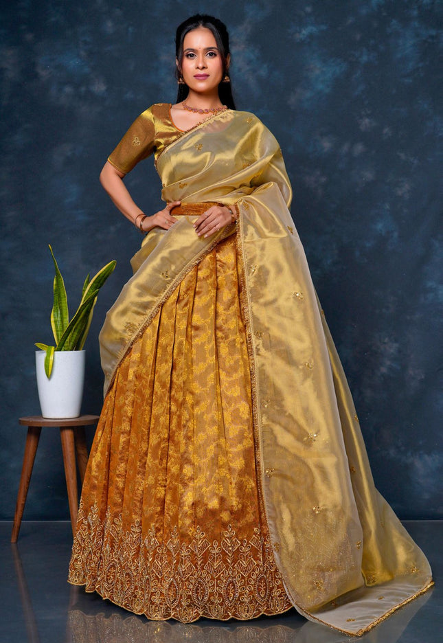 Woman wearing a traditional musterd lehenga choli with dupatta