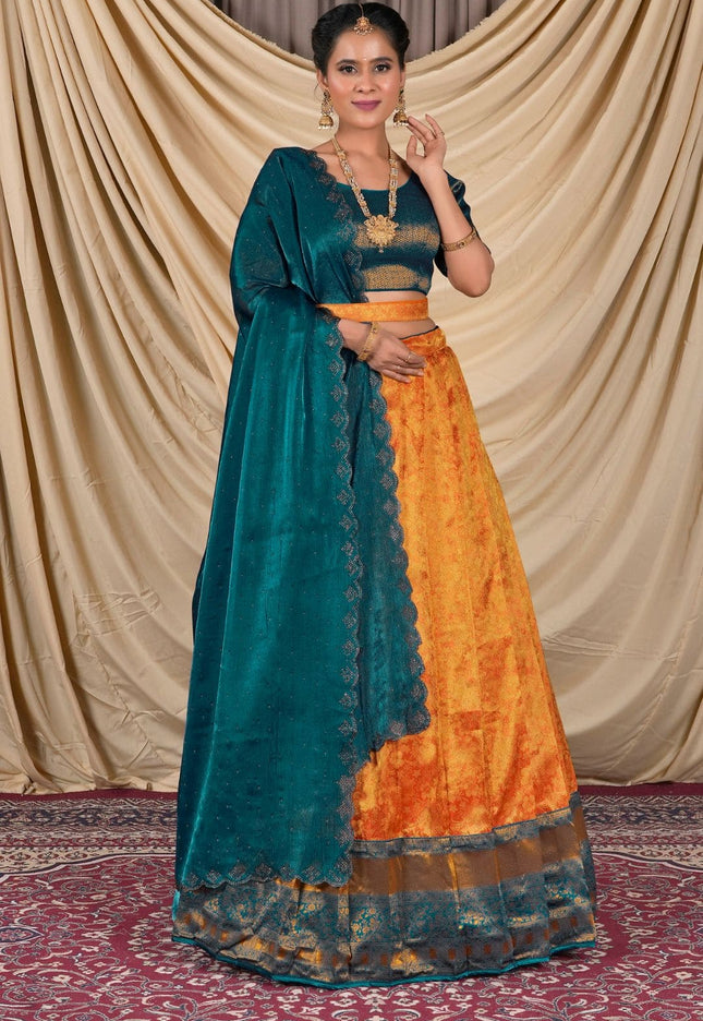 Woman wearing a traditional teal and orange lehenga choli and dupatta