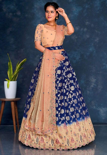 Woman wearing a traditional outfit with a blue and peach design