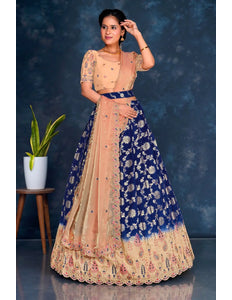 Woman wearing a traditional outfit with a blue and peach design