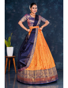 Woman wearing a traditional outfit with an orange and Blue Half Saree