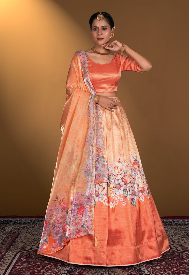 Woman wearing a peach lehenga choli with floral patterns