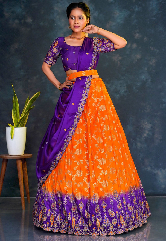 Woman wearing a traditional purple and orange lehenga choli