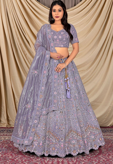 Woman wearing a traditional purple embroidered outfit