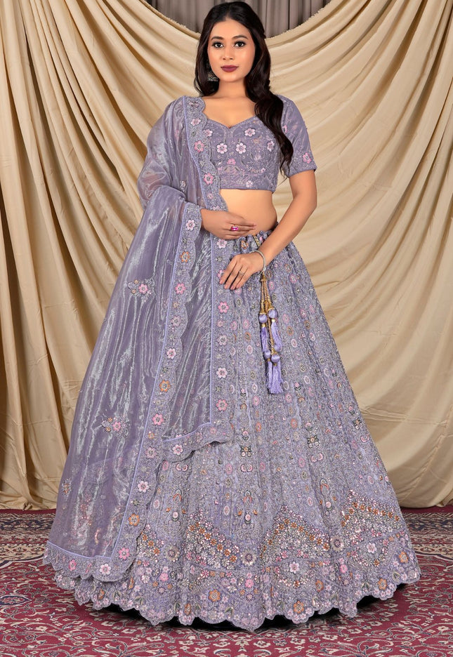 Woman wearing a traditional purple embroidered outfit