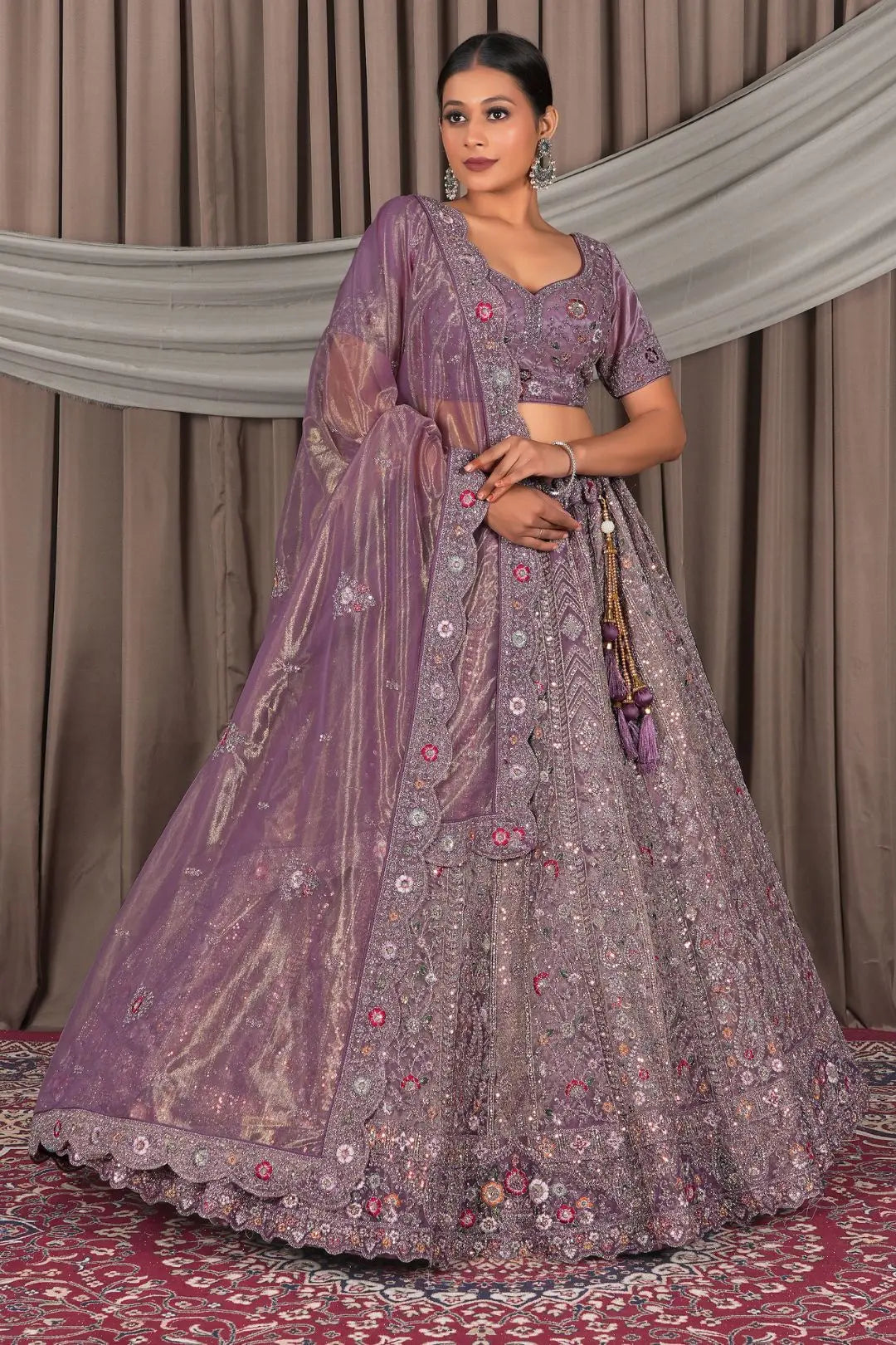 Woman wearing a traditional purple embroidered outfit
