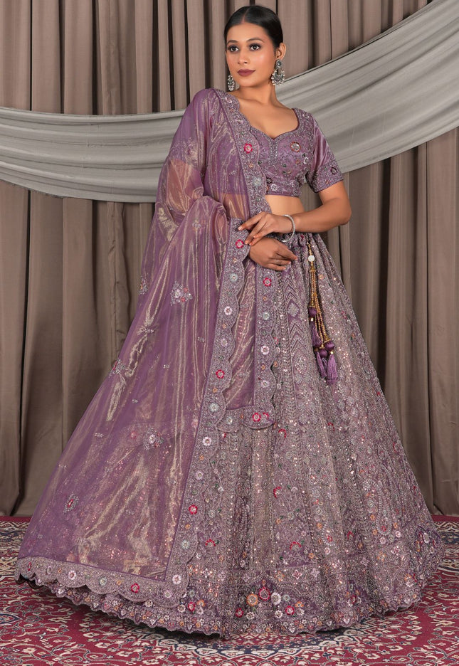 Woman wearing a traditional purple embroidered outfit