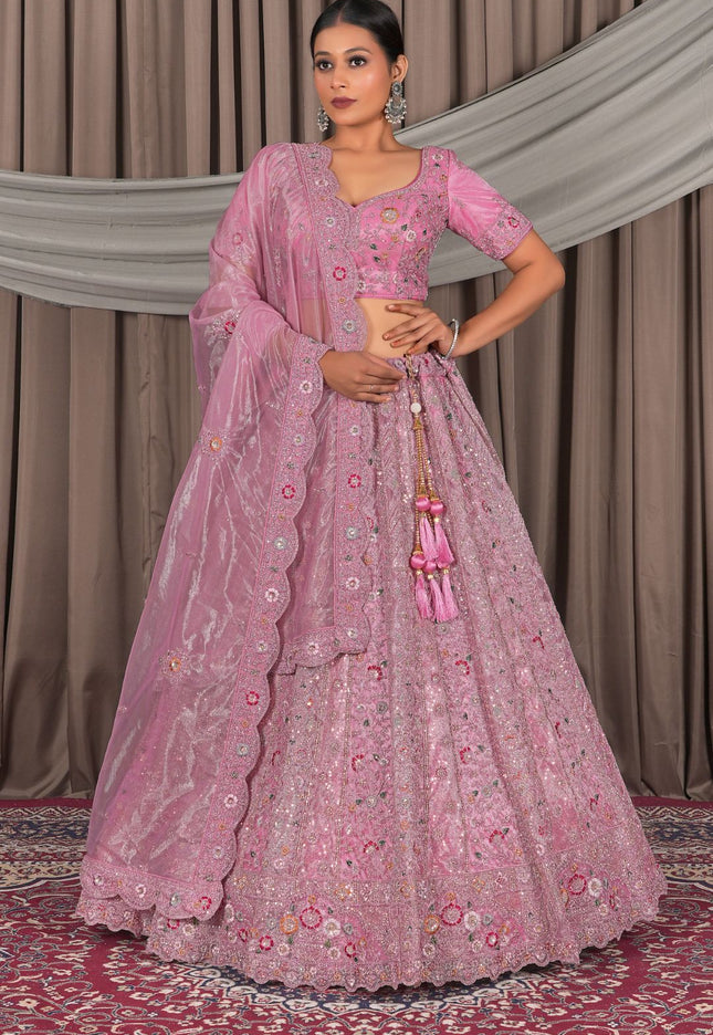 Woman in a pink traditional outfit with floral patterns