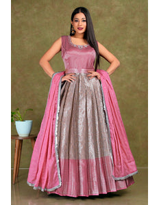 Woman wearing a pink and gray traditional gown with dupatta