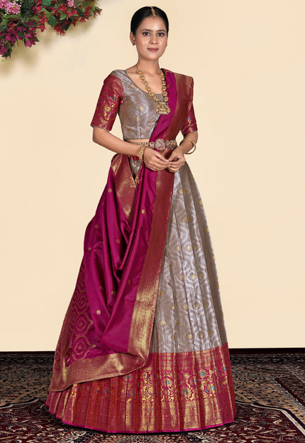 Woman wearing a traditional lehenga with a pink and gold pattern