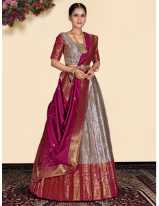 Woman wearing a traditional lehenga with a pink and gold pattern