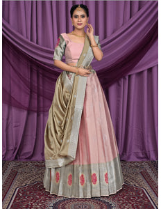 Woman wearing a traditional pink and gold outfit