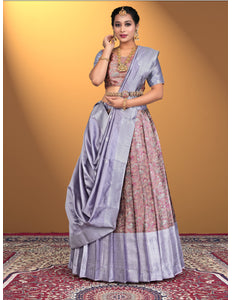 Woman wearing a traditional outfit with a purple lehenga and pink blouse