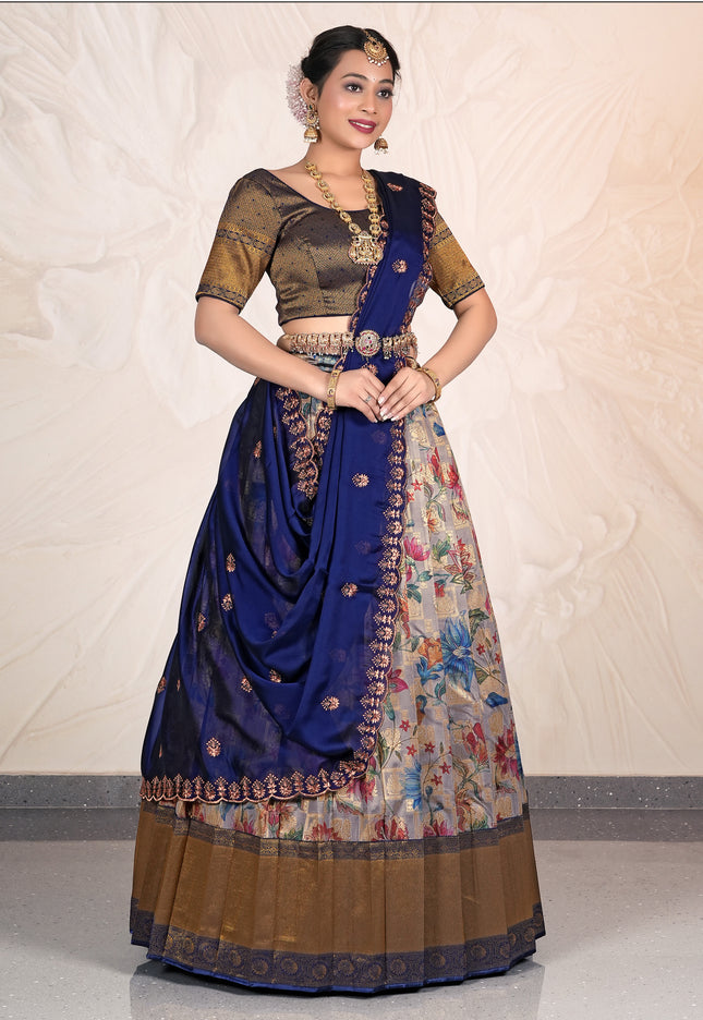 Woman wearing a traditional outfit with a blue and patterned skirt