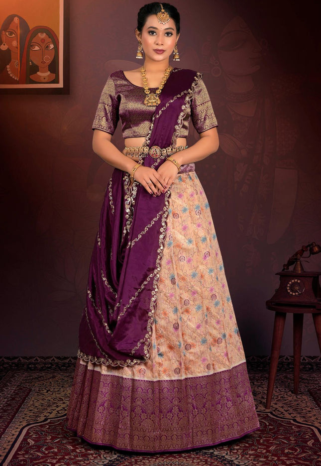 Woman in a traditional outfit with a peach lehenga and purple blouse