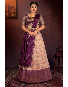 Woman in a traditional outfit with a peach lehenga and purple blouse