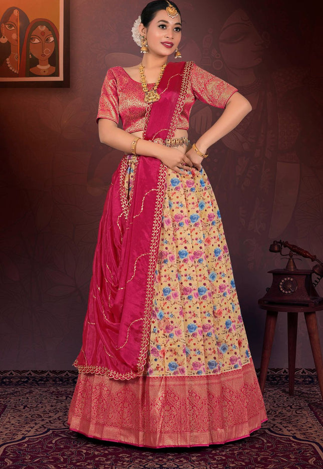 Woman in traditional pink and floral lehenga choli with dupatta
