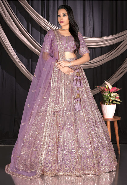 Woman in a purple embroidered traditional chaniya choli