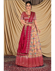 Woman wearing a traditional outfit with a pink lehenga and floral print