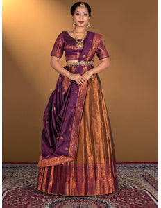 Woman wearing a traditional purple and orange lehenga choli
