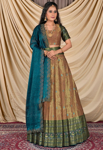 Woman wearing a traditional outfit with a blue dupatta