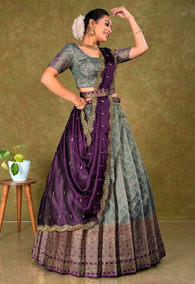 Woman in a traditional outfit with a purple and Peacock lehenga choli