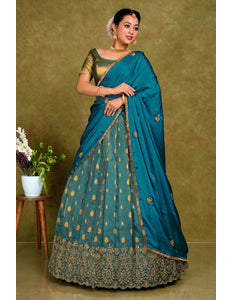 Woman wearing a traditional Peacock lehenga with gold patterns