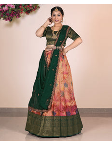 Woman wearing a traditional Pink and Green lehenga